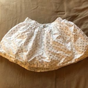 White skirt with silver flowers. No stains.